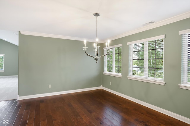 empty room featuring ornamental molding, hardwood / wood-style floors, visible vents, and baseboards