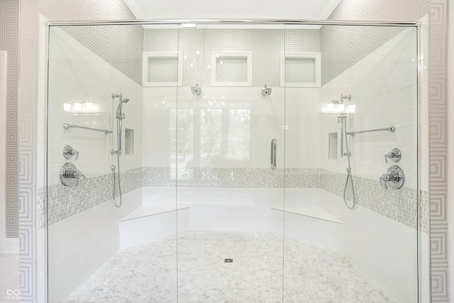 full bath featuring a shower stall