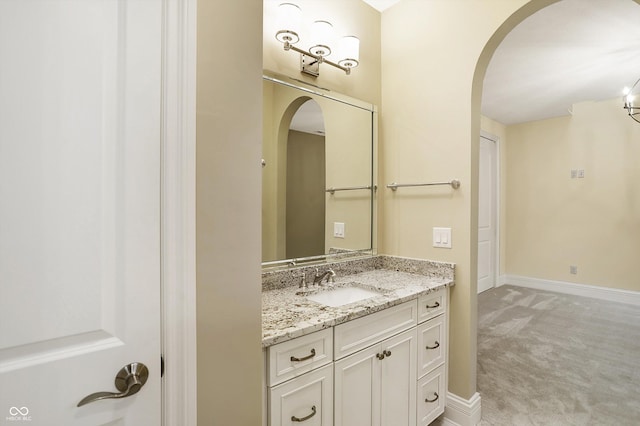 bathroom featuring vanity and baseboards