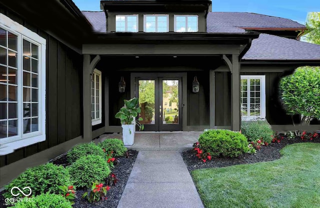 property entrance with french doors and roof with shingles