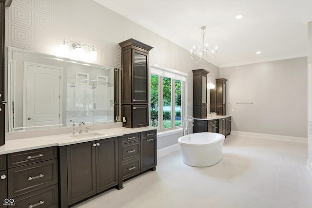 full bathroom with a stall shower, crown molding, baseboards, and a sink