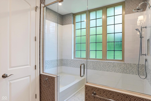 full bathroom with a stall shower, tile patterned flooring, and a bath