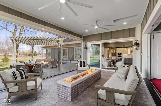 view of patio / terrace featuring an outdoor living space with a fire pit and a pergola