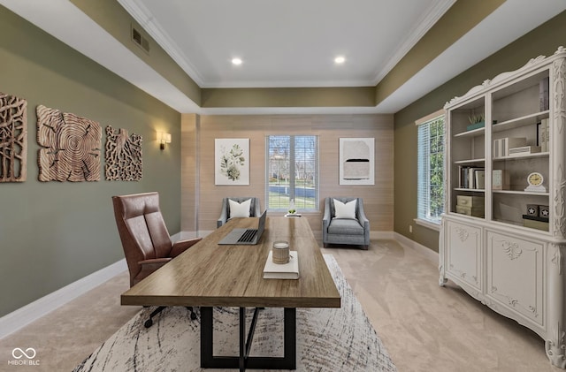 office space with visible vents, ornamental molding, a healthy amount of sunlight, light carpet, and baseboards