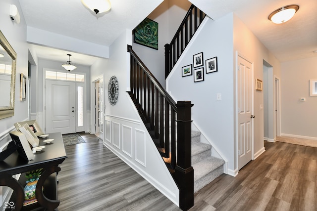 foyer entrance with dark wood-type flooring