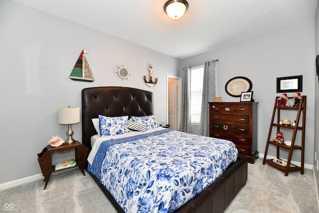 bedroom featuring light colored carpet