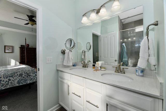 bathroom featuring vanity, ceiling fan, and a shower with shower door