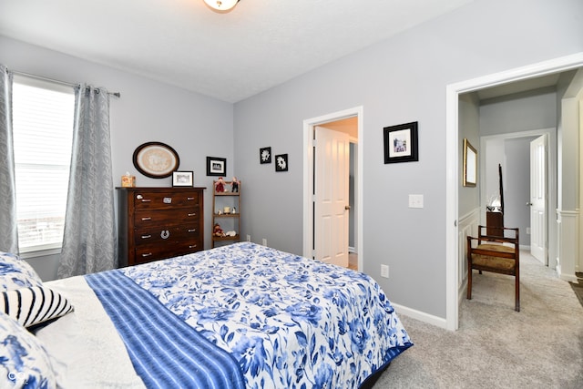 bedroom featuring light carpet