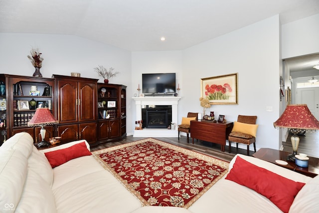 living room with vaulted ceiling and hardwood / wood-style floors