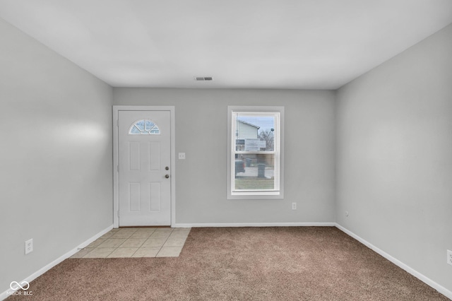 entrance foyer with light colored carpet