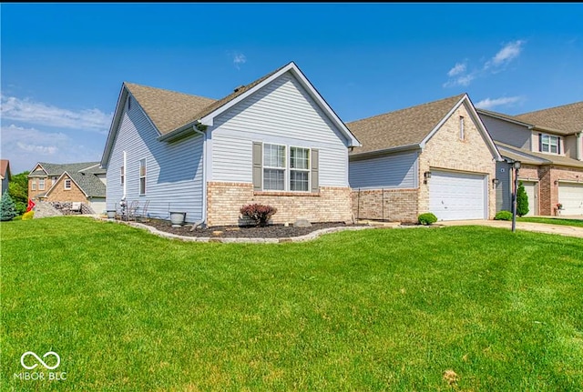 view of front of home with a garage, driveway, a front lawn, and brick siding