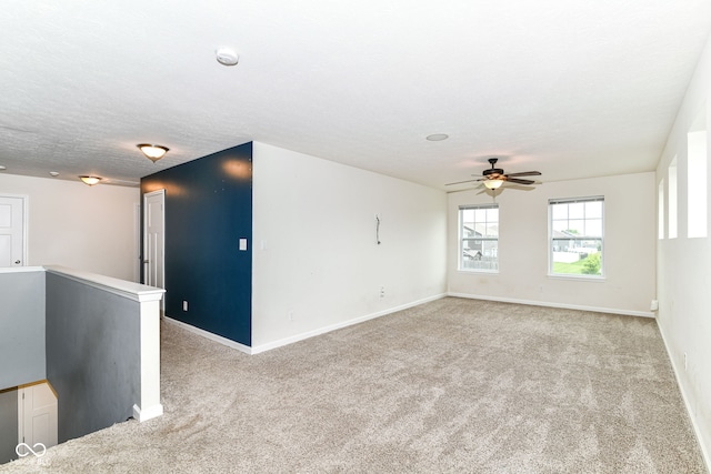 1324 Trailside Dr, Greenwood, IN 46143 - unfurnished room with light carpet, a ceiling fan, a smoke detector, and baseboards