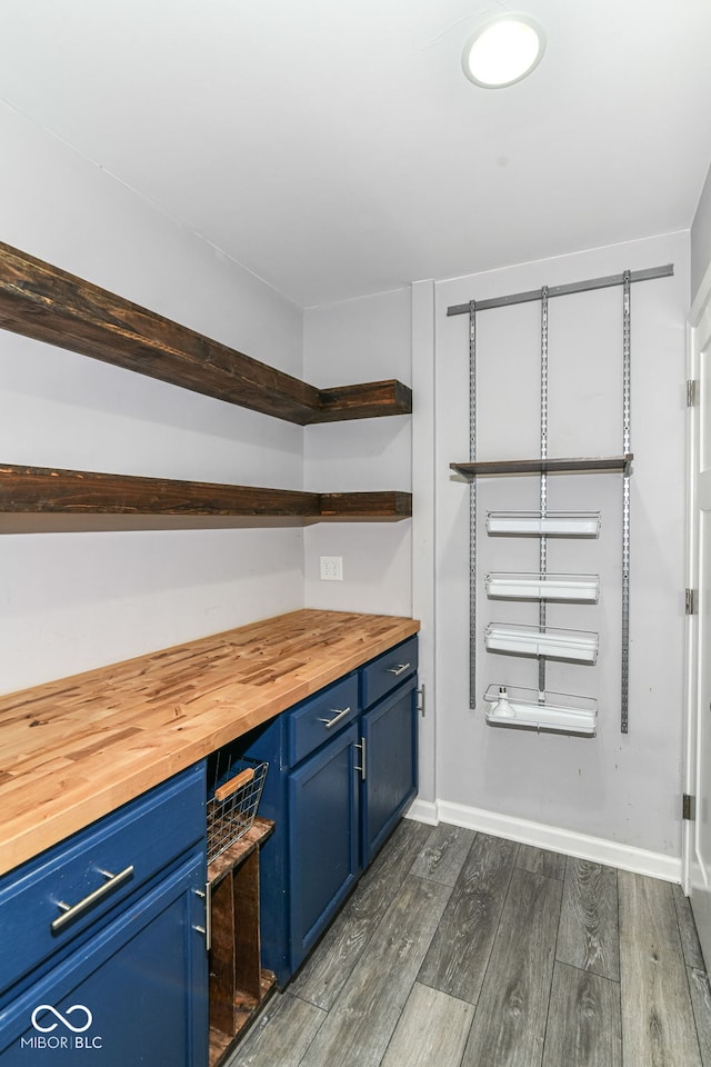1324 Trailside Dr, Greenwood, IN 46143 - bar featuring dark wood-style floors and baseboards