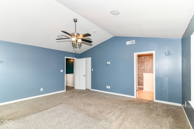 1324 Trailside Dr, Greenwood, IN 46143 - unfurnished bedroom featuring vaulted ceiling, carpet, baseboards, and ensuite bath