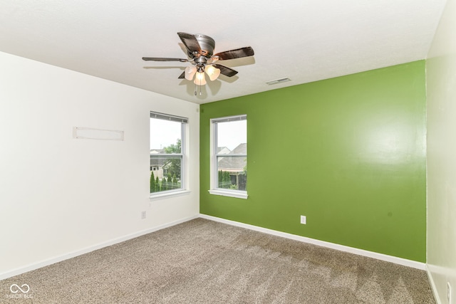 1324 Trailside Dr, Greenwood, IN 46143 - spare room featuring a ceiling fan, baseboards, and carpet