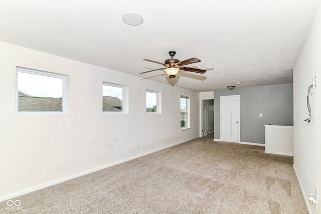 1324 Trailside Dr, Greenwood, IN 46143 - carpeted spare room featuring ceiling fan, baseboards, and a textured ceiling