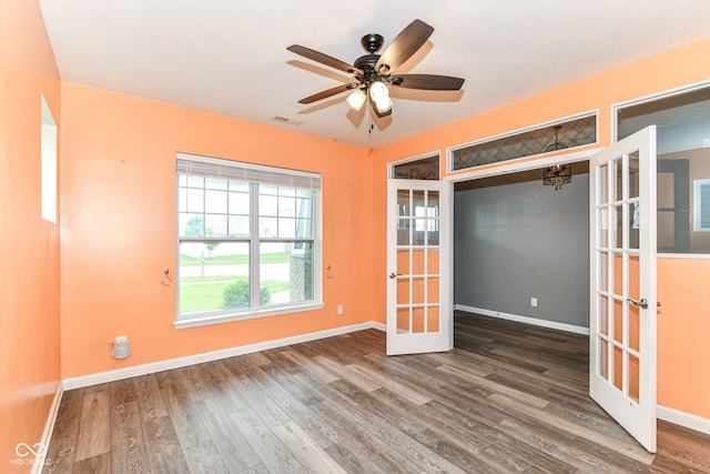 1324 Trailside Dr, Greenwood, IN 46143 - unfurnished room featuring french doors, wood finished floors, baseboards, and a ceiling fan
