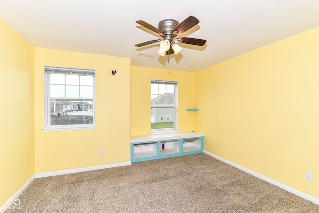 1324 Trailside Dr, Greenwood, IN 46143 - carpeted empty room featuring healthy amount of natural light, baseboards, and a ceiling fan