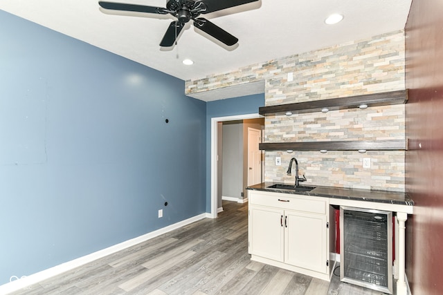 1324 Trailside Dr, Greenwood, IN 46143 - indoor wet bar featuring beverage cooler, a ceiling fan, light wood-style floors, baseboards, and recessed lighting