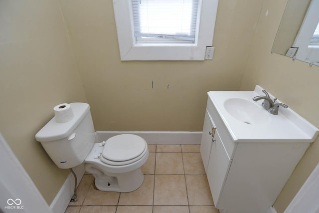 bathroom featuring vanity, tile patterned floors, and toilet