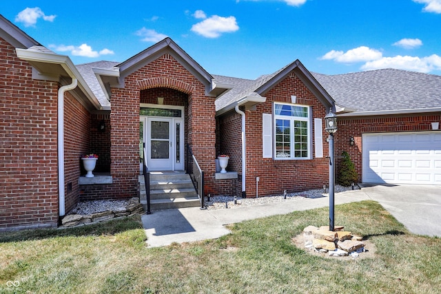 view of front facade with a garage and a front lawn