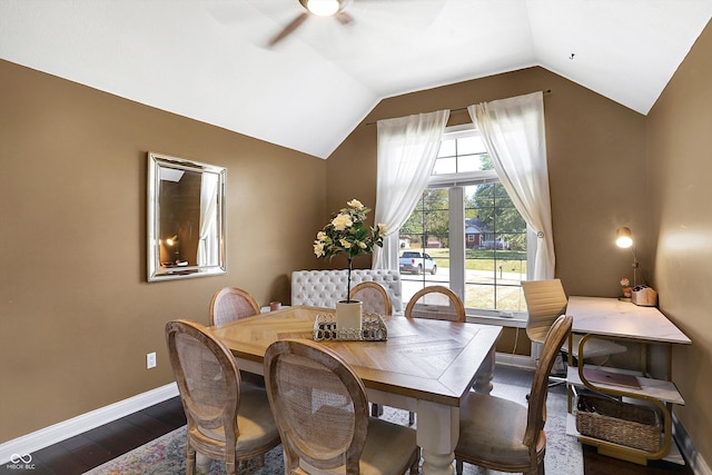 dining room with vaulted ceiling, dark hardwood / wood-style floors, and ceiling fan