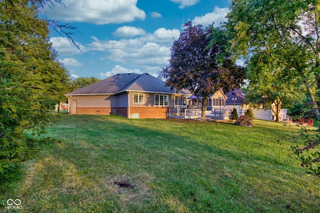 back of property featuring a yard