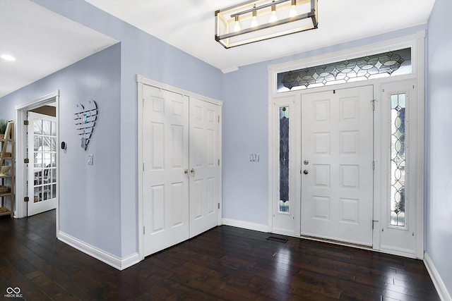 foyer with dark hardwood / wood-style flooring