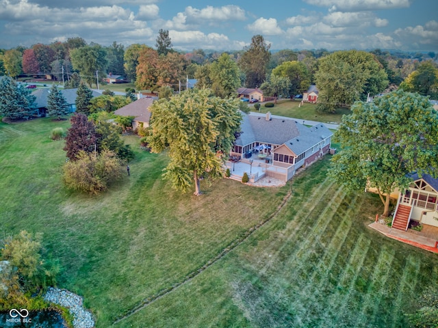 birds eye view of property with a rural view