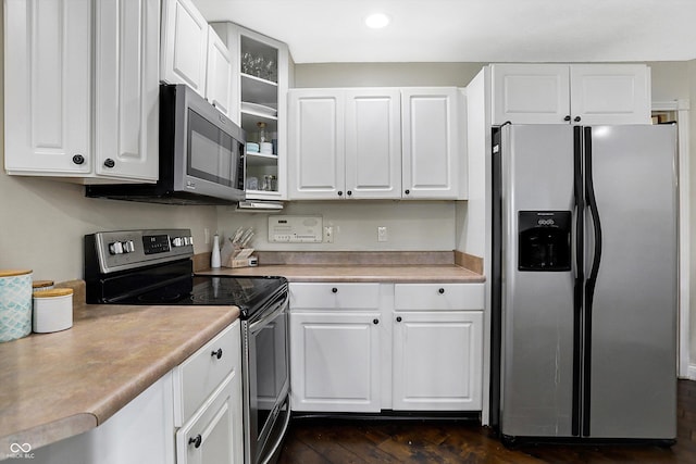 kitchen featuring white cabinets and appliances with stainless steel finishes