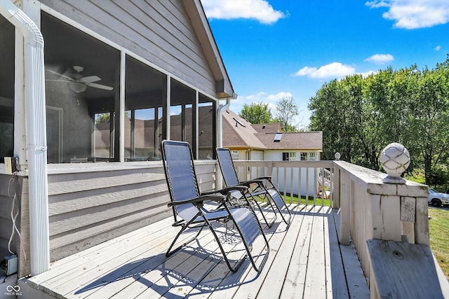 wooden deck with a sunroom