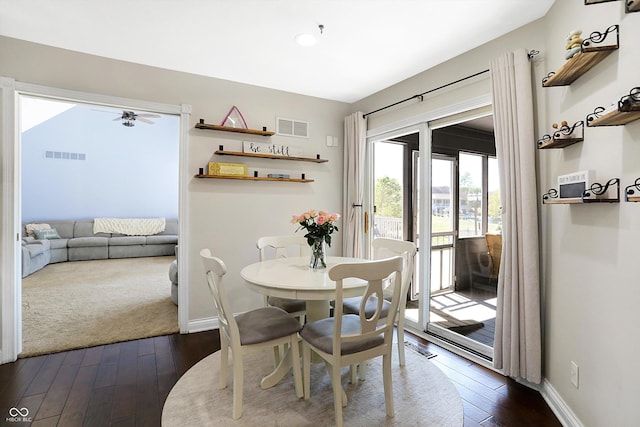 dining space featuring dark hardwood / wood-style flooring