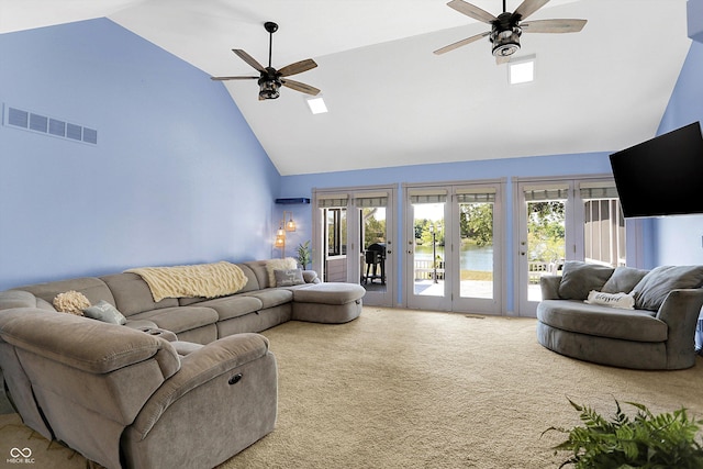 carpeted living room featuring french doors, ceiling fan, high vaulted ceiling, and a wealth of natural light