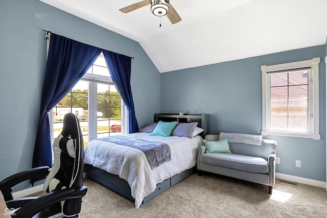 carpeted bedroom featuring lofted ceiling and ceiling fan