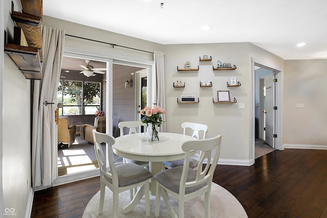 dining area with dark hardwood / wood-style floors and ceiling fan