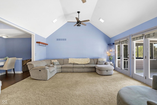 living room featuring high vaulted ceiling, carpet floors, ceiling fan, and french doors