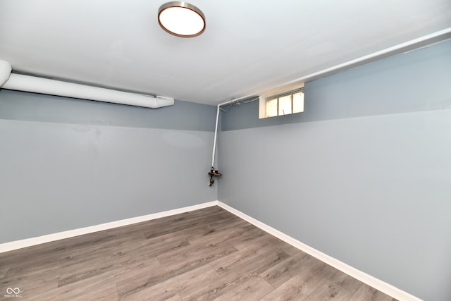 basement with hardwood / wood-style floors