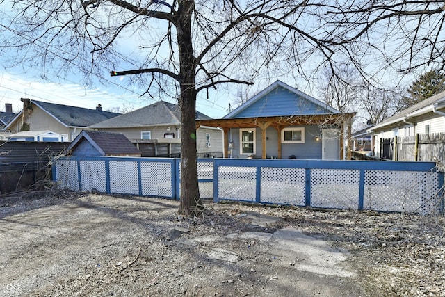 rear view of property featuring a porch