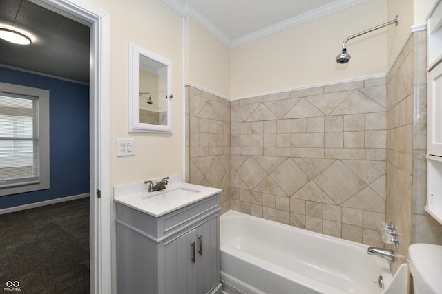 full bathroom featuring crown molding, tiled shower / bath, vanity, and toilet