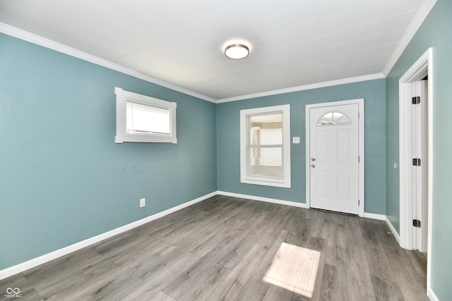 entrance foyer with crown molding and light wood-type flooring