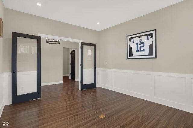 spare room featuring dark wood-type flooring