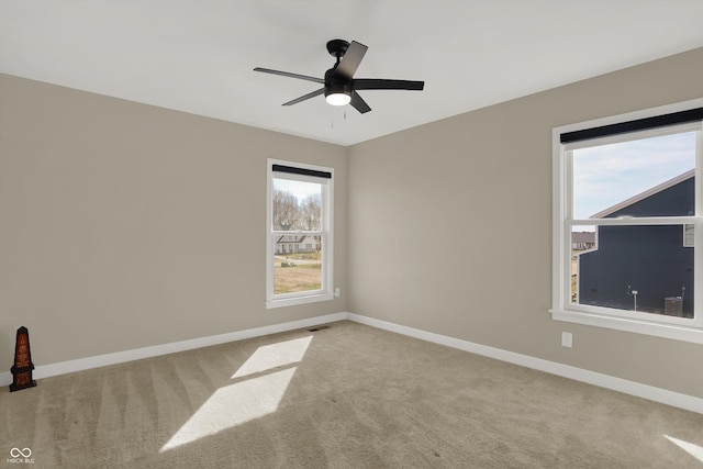 unfurnished room with carpet and ceiling fan