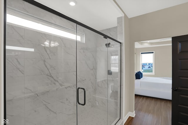 bathroom featuring hardwood / wood-style floors and walk in shower