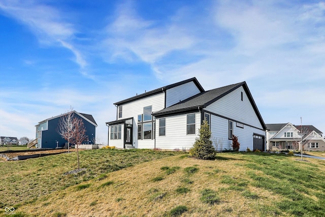 rear view of property with a yard