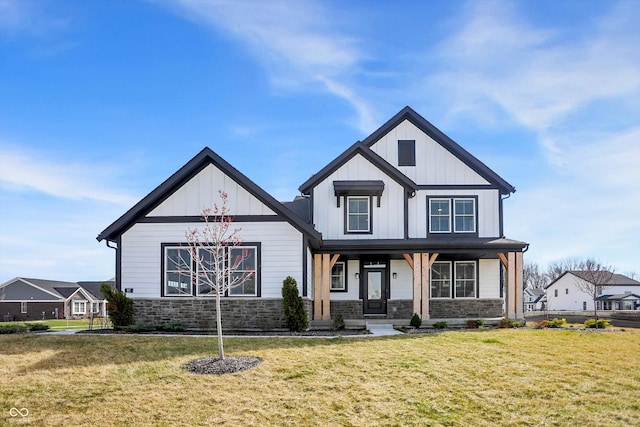 modern inspired farmhouse featuring covered porch and a front yard