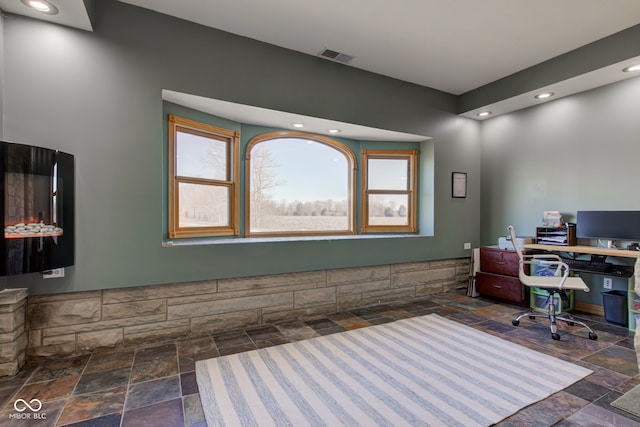 home office with recessed lighting, visible vents, and stone tile flooring