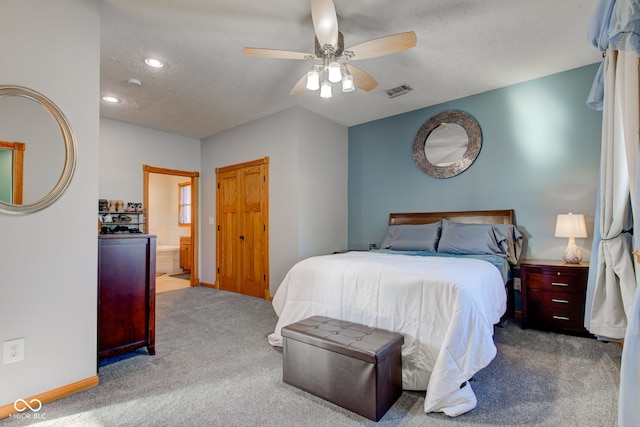 carpeted bedroom with visible vents, ceiling fan, a textured ceiling, and baseboards