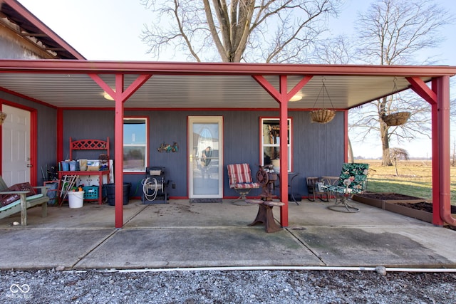 entrance to property featuring a patio