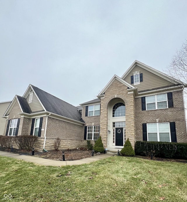 front facade featuring a front yard