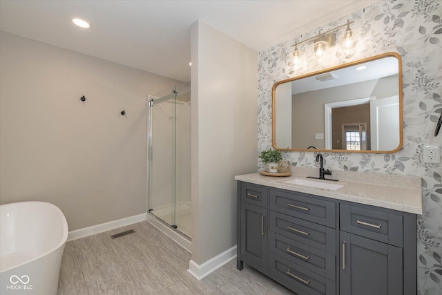 bathroom featuring vanity and separate shower and tub